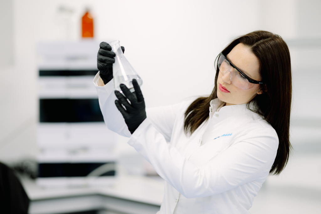 ADRASA specialist validating a textile chemistry formulation in the laboratory