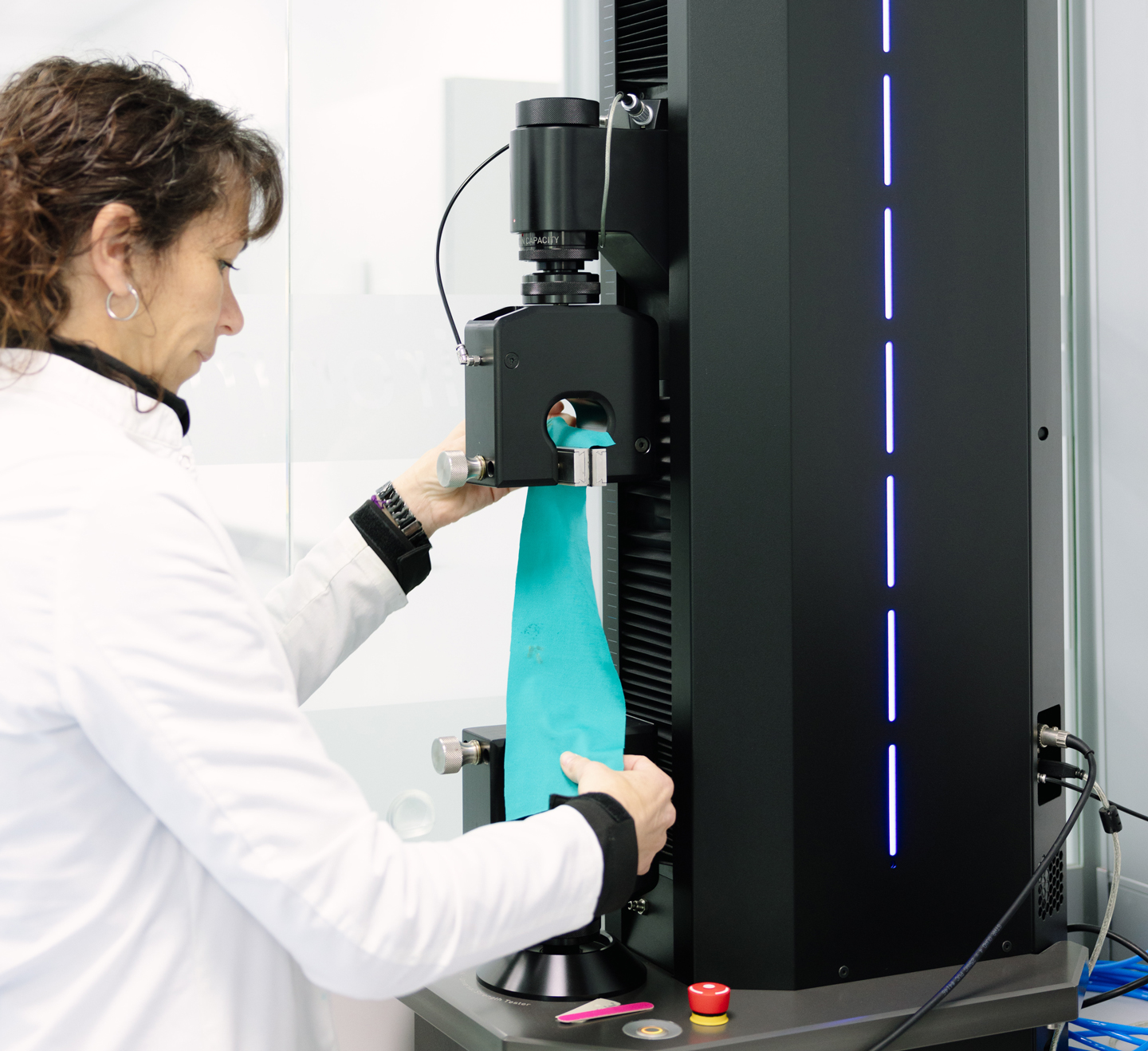 ADRASA specialist testing textile fabric performance in the laboratory